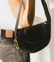 crossbody bag in black with gold buckle