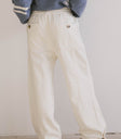 cream pants with button detail pockets