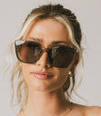 oversized grey sunglasses