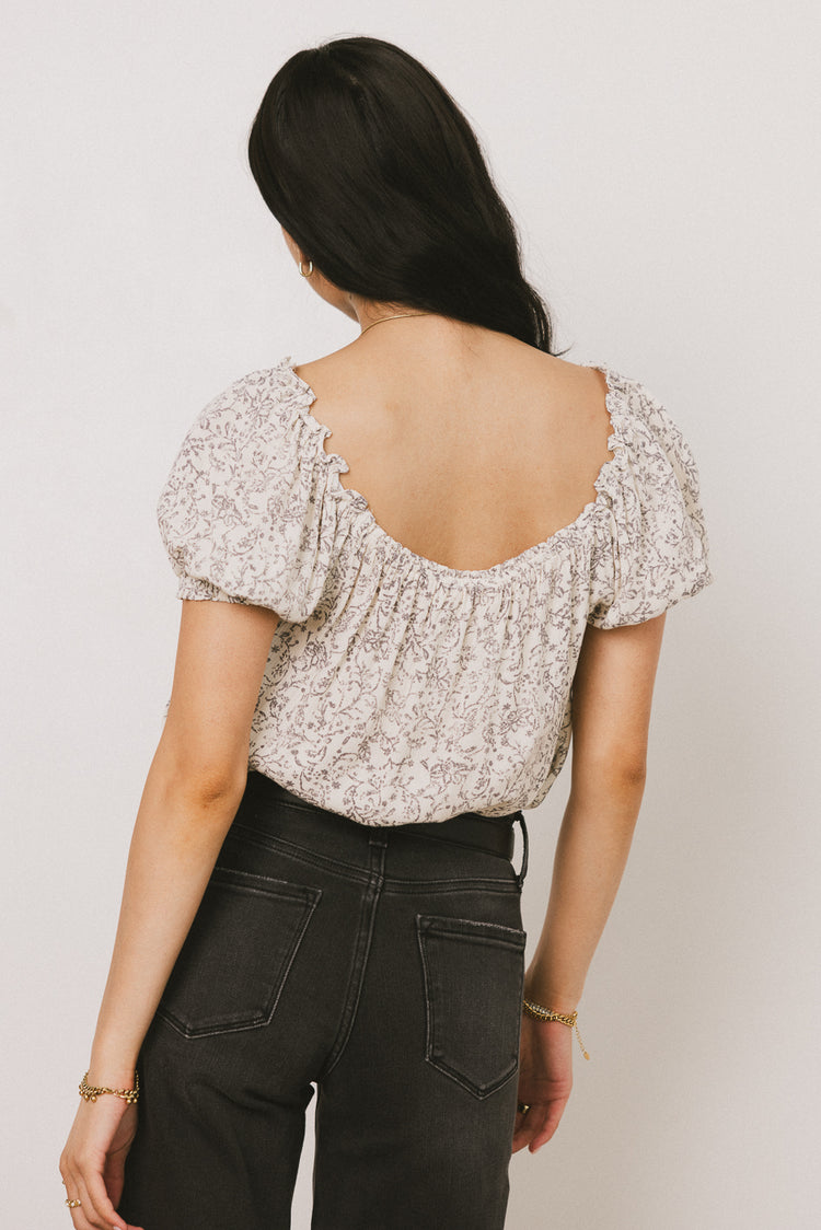 DEEP BACK ON PRINTED BLUSE
