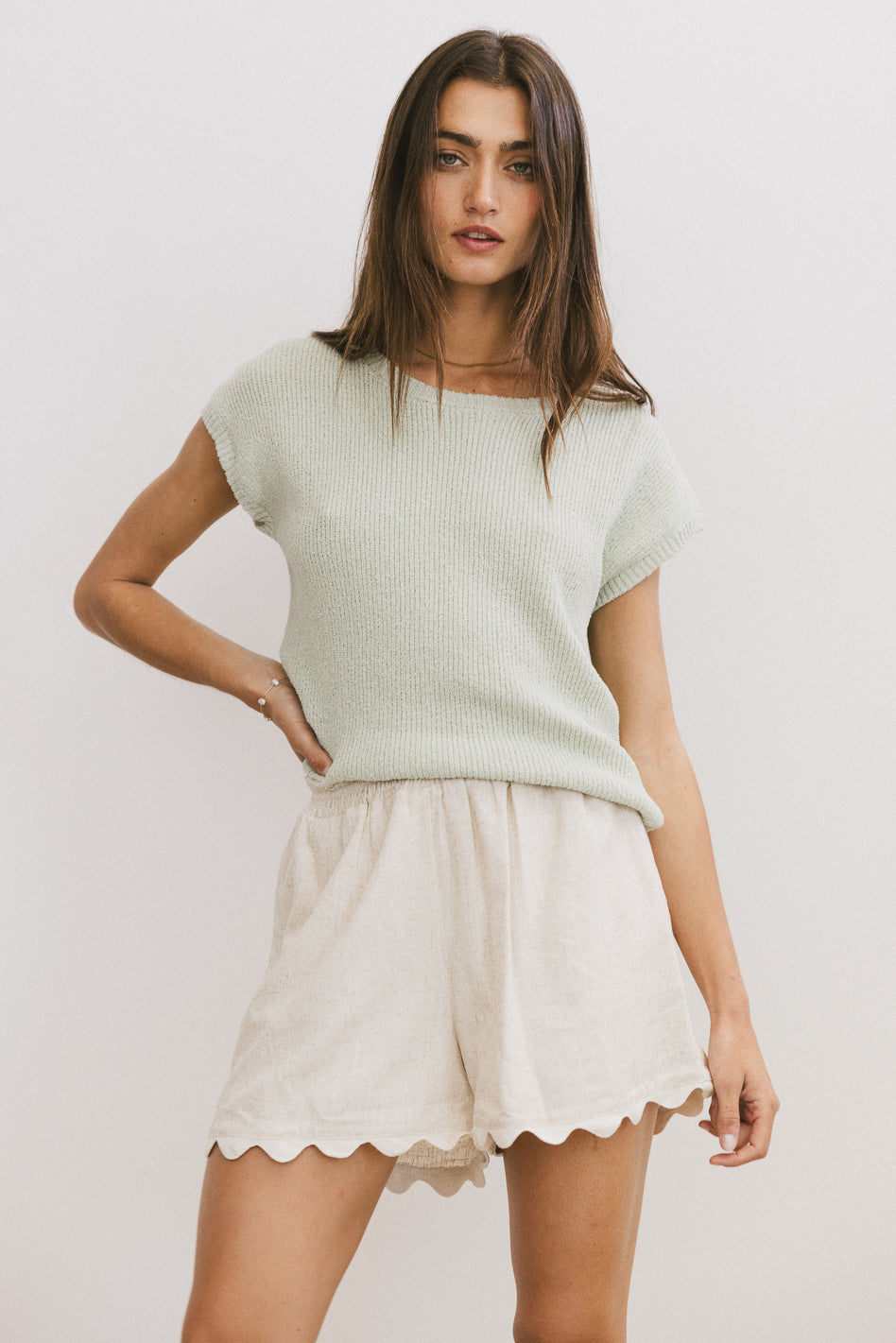 green knit top