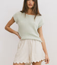 green knit top
